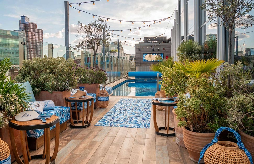 Swimmer relaxing in heated rooftop pool in London