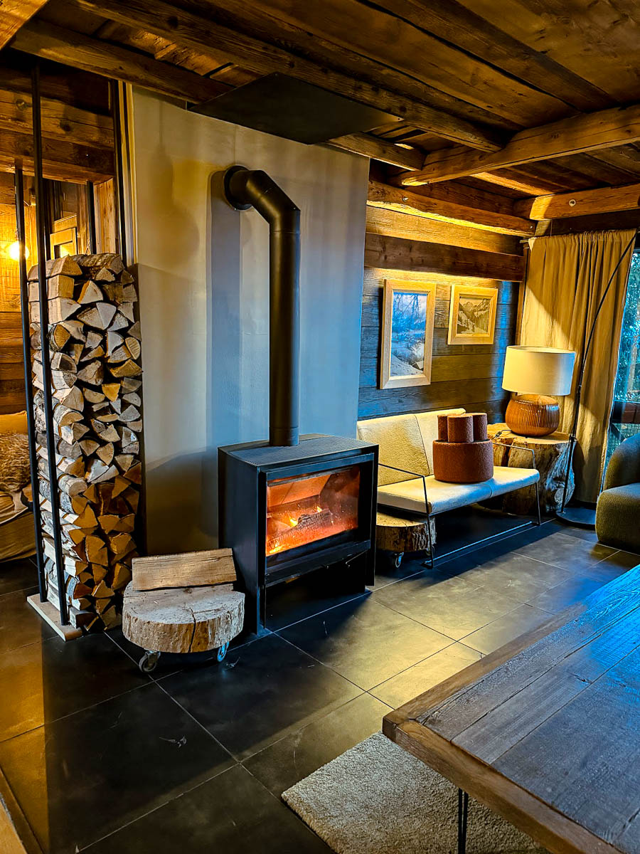 a cosy fireplace and sofas